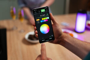 person checking display quality by changing light intensity