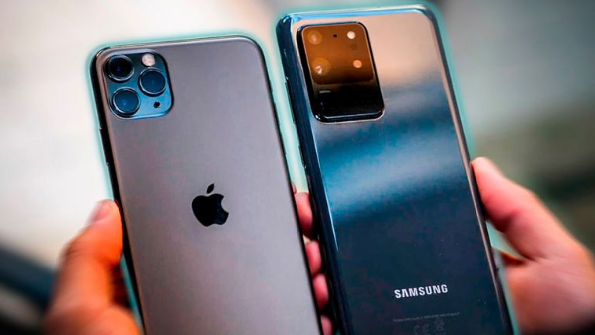 A person holding an Apple iPhone 11 Pro and a Samsung Galaxy S20, showcasing their distinctive rear camera designs.